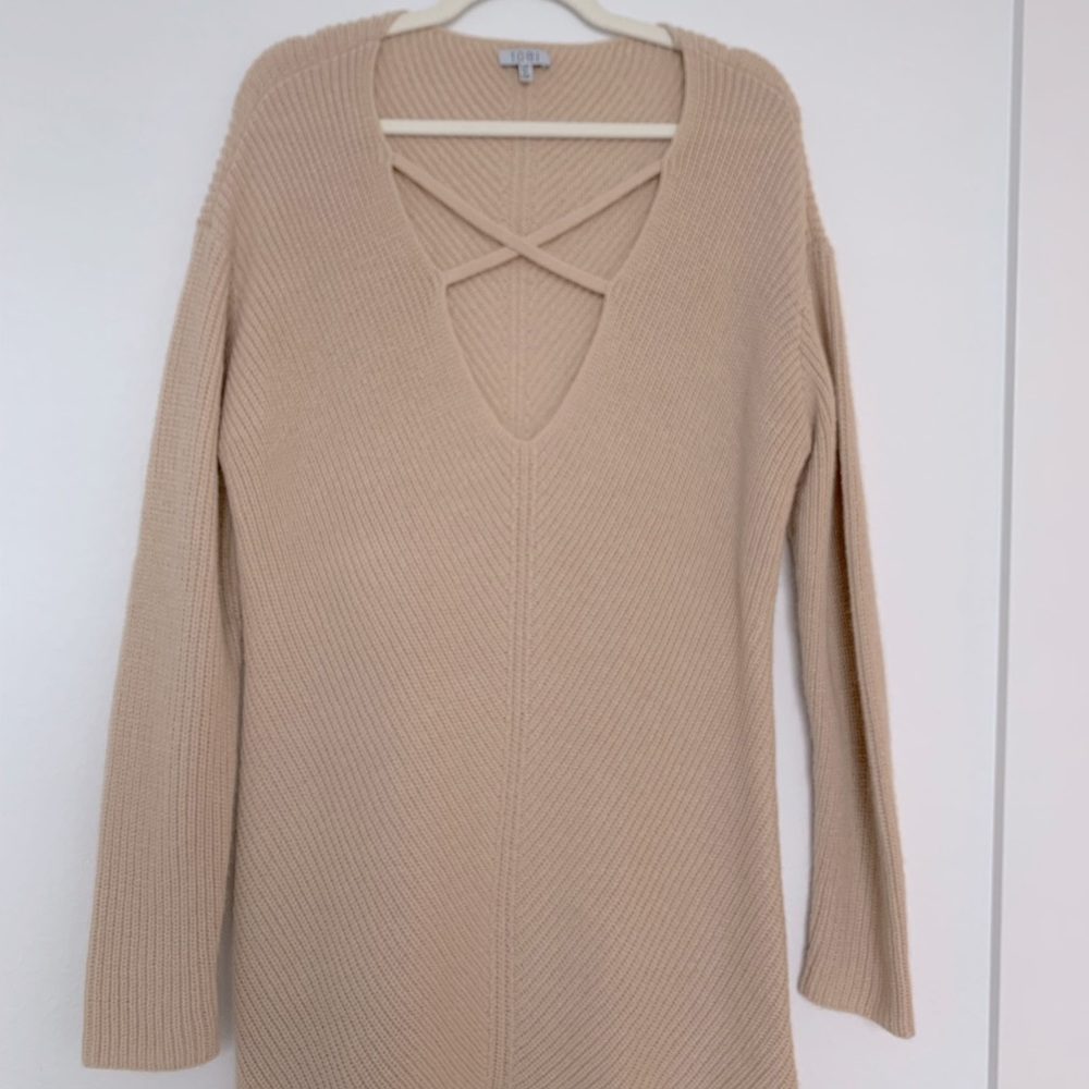 Loose fitting sweater dress with cross straps